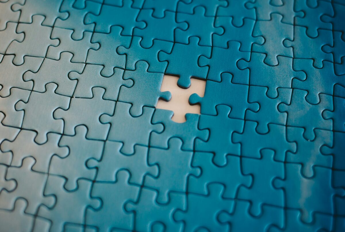 a photo of an azure puzzle with one piece missing
