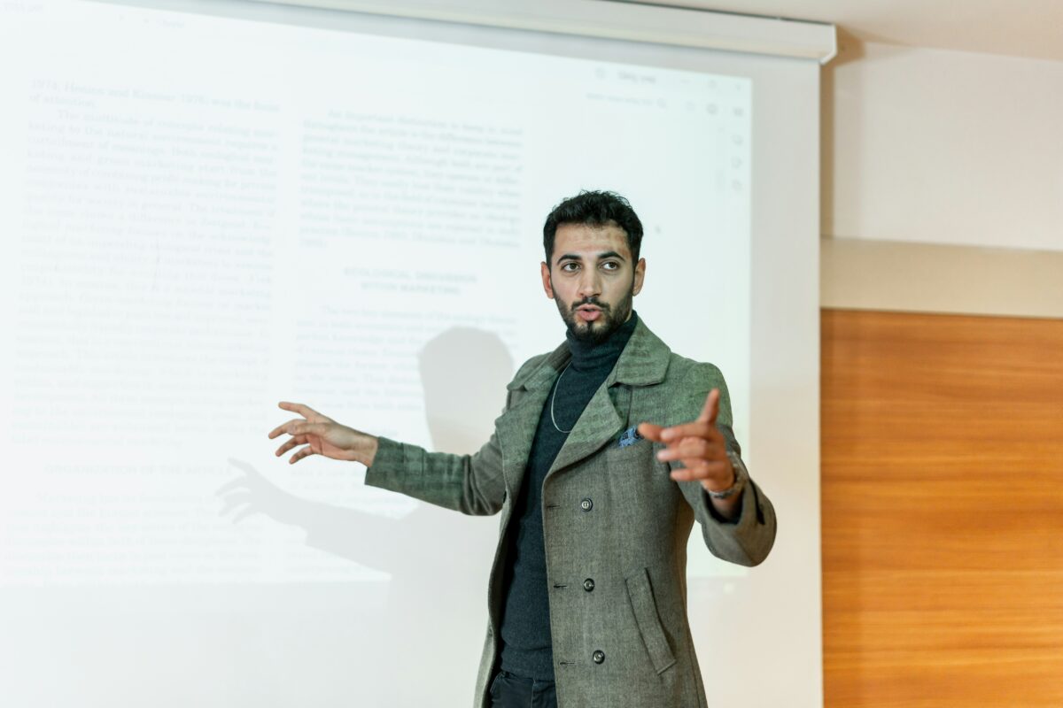 Photo of a Male Asian CEO giving a presentation.